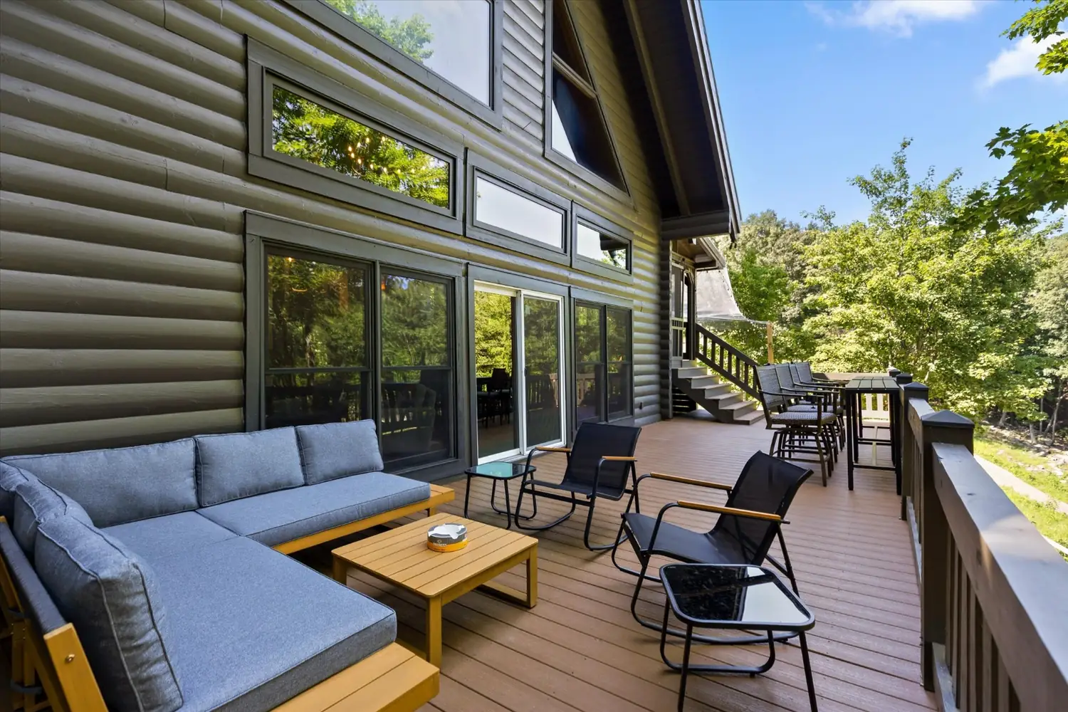 Deck lounge seating with long views over the golf course and valley