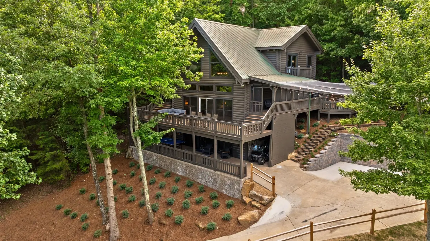 Aerial view of the Eyrie House with decks overlooking the McLemore golf course
